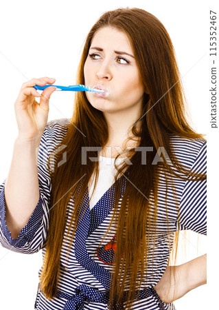 Woman brushing cleaning teeth. 115352467