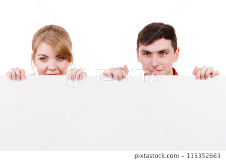 Couple with blank presentation board banner sign Couple with blank presentation board banner sign 115352663