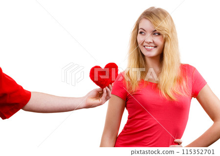Couple in love. Man giving woman red heart 115352701