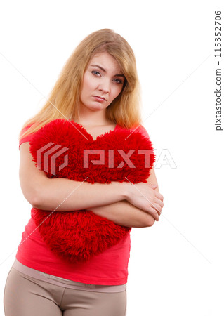 Woman sad girl hugging red heart love symbol Woman sad girl hugging red heart love symbol 115352706