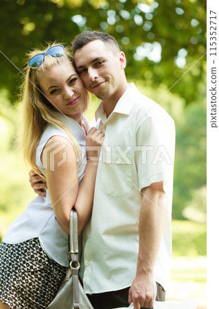 Happy couple having romantic date in park 115352717