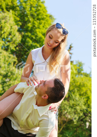 Happy couple having romantic date in park Happy couple having romantic date in park 115352728