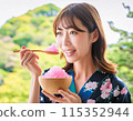 A woman eating shaved ice in hot summer 115352944