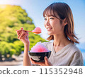 A woman eating shaved ice in hot summer 115352948