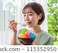 A woman eating shaved ice in hot summer 115352950