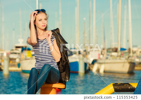 woman in marina against yachts in port 115353425