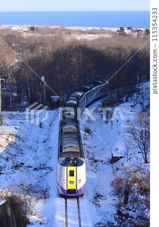 The express train "Ozora" crosses a small mountain pass with the Pacific Ocean in the background The express train "Ozora" crosses a small mountain pass with the Pacific Ocean in the background 115354233