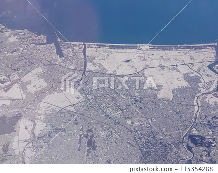 Aerial view of central and eastern Sendai city covered in snow 115354288