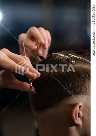 Haircut alignment of the contour of the head with scissors. Short haircut in the barbershop. Haircut alignment of the contour of the head with scissors. Short haircut in the barbershop. 115355559