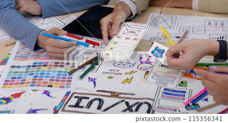 Creative UX Developer and UI Designer Brainstorming Session with Color Palettes, Wireframes, and Sketches for Innovative Digital Solutions Creative UX Developer and UI Designer Brainstorming Session with Color Palettes, Wireframes, and Sketches for Innovative Digital Solutions 115356341