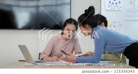 Creative UX Developer and UI Designer Brainstorming Session in Modern Office with Digital Devices and Design Prototypes 115356343