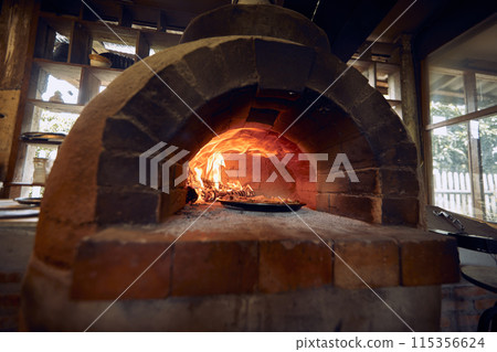 pizza traditional  oven in open kitchen 115356624