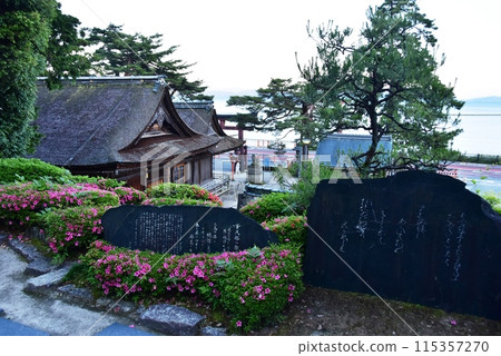 Takashima City, Shiga Prefecture: Murasaki Shikibu's monument in the grounds of Shirahige Shrine, azaleas in full bloom, and Lake Biwa 115357270