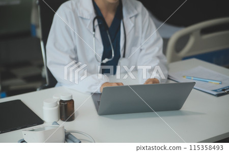 Female doctor explaining to patient results of model the process of patients. Diagnosis of diseases for Model Internal organ. Female doctor explaining to patient results of model the process of patients. Diagnosis of diseases for Model Internal organ. 115358493