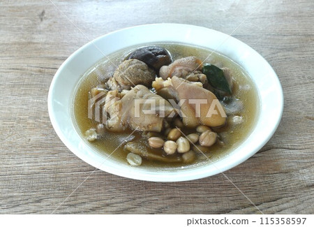 boiled pork knuckle with peanut and ginger with mushroom soup on plate boiled pork knuckle with peanut and ginger with mushroom soup on plate 115358597