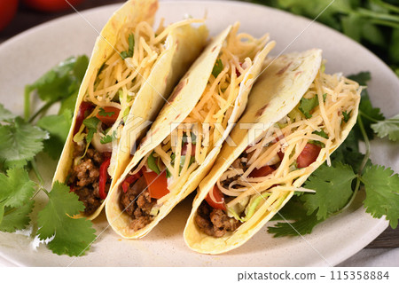 Taco with ground beef, cabbage and cheese Taco with ground beef, cabbage and cheese 115358884