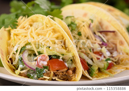 Beef and avocado tacos 115358886