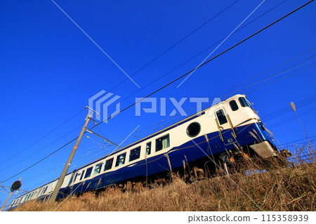 Running under the blue sky of early spring 115358939