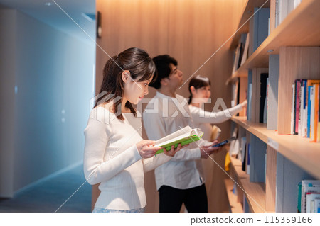 People searching for books in the library People searching for books in the library 115359166