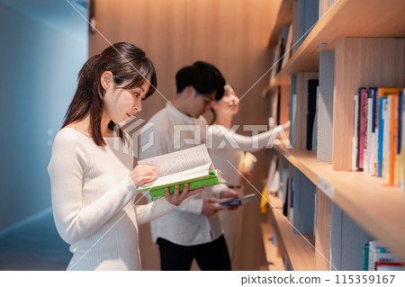 People searching for books in the library People searching for books in the library 115359167