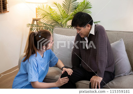 Caregiver Assisting Elderly Man with Physical Therapy at Home, Providing Support and Encouragement in a Comfortable Living Room Setting Caregiver Assisting Elderly Man with Physical Therapy at Home, Providing Support and Encouragement in a Comfortable Living Room Setting 115359181