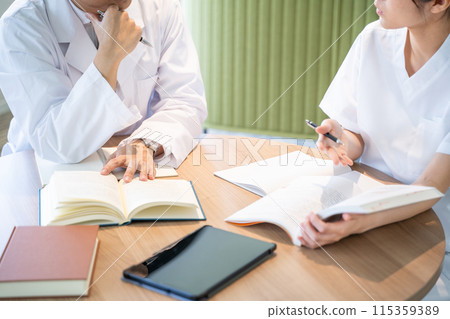 Nurses and doctors studying Nurses and doctors studying 115359389