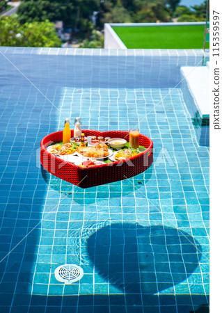 Floating brekfast in a heart shape in Patong, in Phuket, Thailand Floating brekfast in a heart shape in Patong, in Phuket, Thailand 115359597