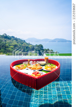 Floating brekfast in a heart shape in Patong, in Phuket, Thailand 115359667