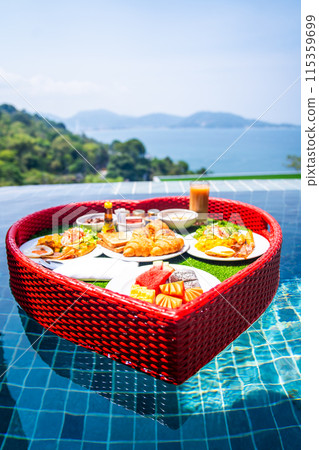 Floating brekfast in a heart shape in Patong, in Phuket, Thailand 115359699