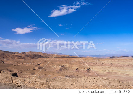 View of the old city walls and hills from the Kasbah of Ait Ben Haddou. View of the old city walls and hills from the Kasbah of Ait Ben Haddou. 115361220