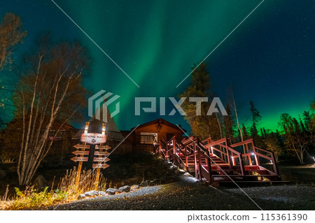 Yellowknife, Northwest Territories, Canada - September 24 2022 : Northern lights at Aurora Village in Yellowknife night. Yellowknife, Northwest Territories, Canada - September 24 2022 : Northern lights at Aurora Village in Yellowknife night. 115361390