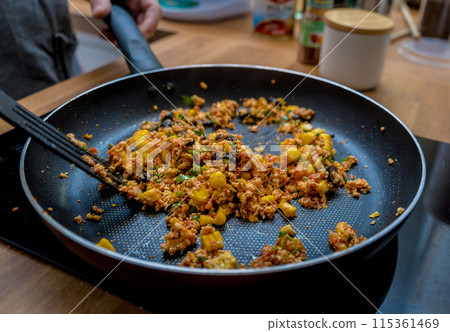 Chef at the kitchen preparing quesadillas with tofu and sweet corn 115361469