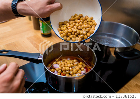 Chef at the kitchen preparing massaman curry with sweet potato and many spices 115361525