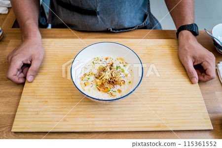 Rice porridge with caramelized onions and sesame seeds Rice porridge with caramelized onions and sesame seeds 115361552