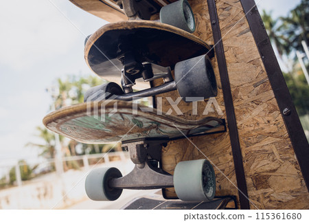 A stack of skateboards on a special outdoor stand A stack of skateboards on a special outdoor stand 115361680