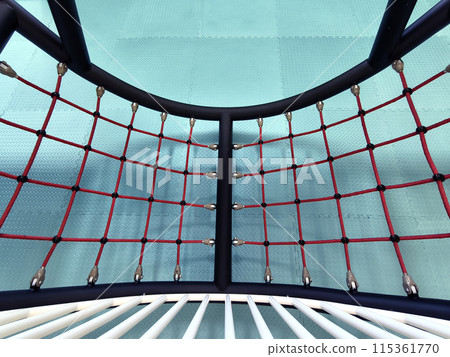 The trampoline features a mazepatterned surface for recreational use indoors The trampoline features a mazepatterned surface for recreational use indoors 115361770
