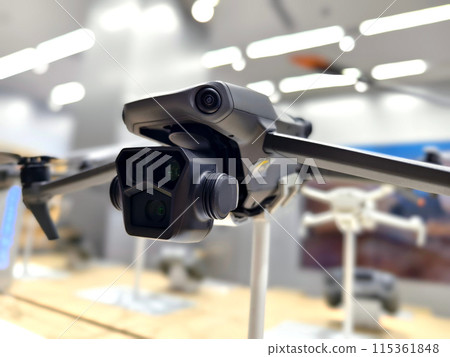 Modern drone for video and photo in the light store Modern drone for video and photo in the light store 115361848