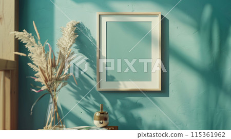 smooth light-wooden photo frame hung on a country-side wall 115361962