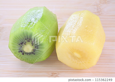 Peeled green and gold kiwi fruit Peeled green and gold kiwi fruit 115362249