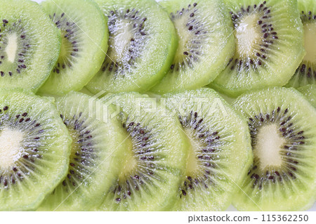 Green kiwi slices, arranged side by side Green kiwi slices, arranged side by side 115362250