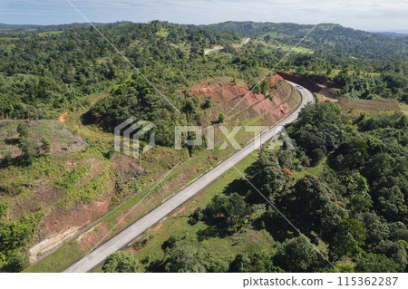 Countryside empty road in green landscape Countryside empty road in green landscape 115362287