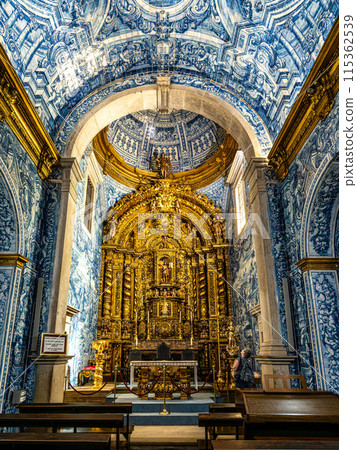 Main altar of Igreja de Sao Lourenco church in Almancil, Portugal, with religious sculptures and azulejos. Main altar of Igreja de Sao Lourenco church in Almancil, Portugal, with religious sculptures and azulejos. 115362539