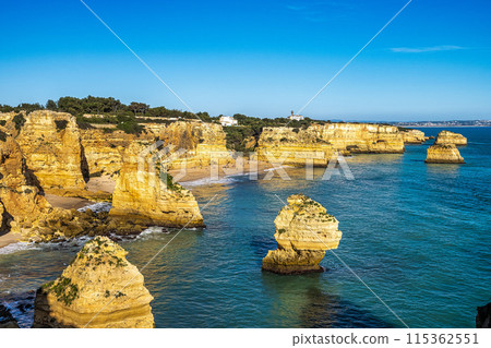 Praia da Marinha Beach among rock islets and cliffs seen from Seven Hanging Valleys Trail, Algarve, Portugal Praia da Marinha Beach among rock islets and cliffs seen from Seven Hanging Valleys Trail, Algarve, Portugal 115362551