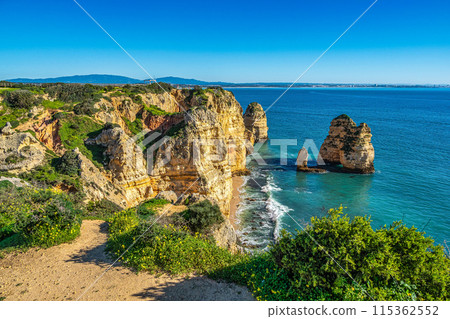 Ponta da Piedade is a unique rock formation with famous grottos in the ocean at Lagos, Algrave, Portugal Ponta da Piedade is a unique rock formation with famous grottos in the ocean at Lagos, Algrave, Portugal 115362552