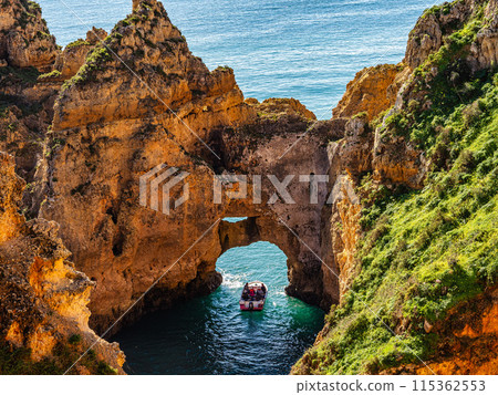 Ponta da Piedade is a unique rock formation with famous grottos in the ocean at Lagos, Algrave, Portugal 115362553