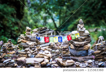 Buddhist Mantra on multicolored flags in himalayas on Annapurna 115363360