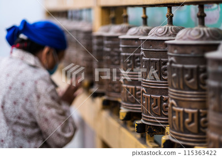 Prayer wheels in Boudhanath Stupa in Kathmandu, Nepal 115363422