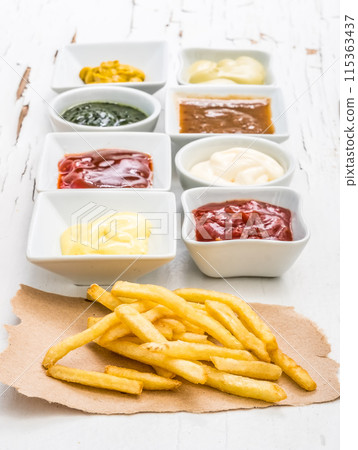 French fries with different sauces 115363437