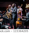 Jazz player playing saxophone in a jazz bar 115364205