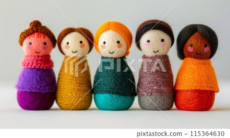 Colorful knitted dolls with smiling faces 115364630